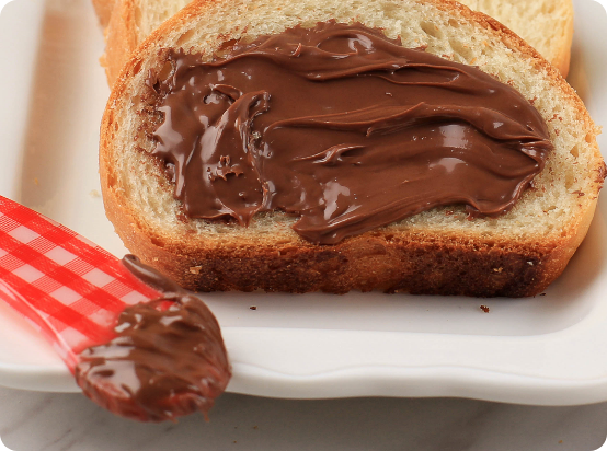 sliced-fresh-homemade-bread-with-spread-chocolate-hazelnuts-cream-breakfast